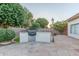 Image of the outdoor kitchen with a built-in grill and landscaped yard at 2625 W Oakland St, Chandler, AZ 85224