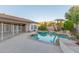 Relaxing backyard pool features rock accents and lush landscaping at 2625 W Oakland St, Chandler, AZ 85224