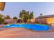 Private backyard pool with rock features and mature landscaping at 2625 W Oakland St, Chandler, AZ 85224