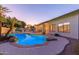 Sparkling pool and backyard with lush tropical landscaping, ideal for entertaining at 2625 W Oakland St, Chandler, AZ 85224