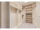 A large walk-in closet with custom shelving and ample storage space at 2625 W Oakland St, Chandler, AZ 85224