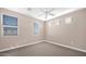 Bright bedroom featuring neutral walls, carpet, and multiple windows for natural light at 2821 S Skyline Dr # 149, Mesa, AZ 85212