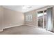 Bright bedroom featuring sliding glass doors that lead to a balcony at 2821 S Skyline Dr # 149, Mesa, AZ 85212