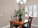 Cozy dining area with a wood table, decorative chandelier, and natural light at 2821 S Skyline Dr # 149, Mesa, AZ 85212