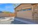 Attached two-car garage featuring brick and a well maintained paved driveway at 2821 S Skyline Dr # 149, Mesa, AZ 85212