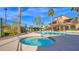 Relaxing community hot tub surrounded by lush landscaping and clear blue skies at 2821 S Skyline Dr # 149, Mesa, AZ 85212