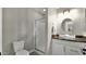 Bathroom featuring a modern vanity, glass enclosed shower, and neutral finishes at 3119 E Rosemonte Dr, Phoenix, AZ 85050