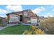 Beautiful home with a well-manicured lawn and desert landscaping, set against a backdrop of clear blue skies and fluffy white clouds at 3119 E Rosemonte Dr, Phoenix, AZ 85050