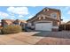 Charming two-story home with a spacious driveway and attached garage, featuring desert landscaping for a low-maintenance yard at 3119 E Rosemonte Dr, Phoenix, AZ 85050