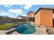 Sparkling swimming pool with rock accents, surrounded by well-manicured landscaping at 3119 E Rosemonte Dr, Phoenix, AZ 85050