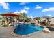 Backyard view of the pool with stone features and beautiful waterfall at 3132 E Harwell Rd, Phoenix, AZ 85042