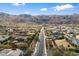 Overhead street view presenting a straight road with greenery, homes, and a mountain backdrop, highlighting the neighborhood's layout at 3132 E Harwell Rd, Phoenix, AZ 85042