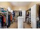 Spacious walk-in closet with custom shelving and ample storage for clothes and accessories at 3132 E Harwell Rd, Phoenix, AZ 85042