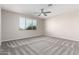 Neutral bedroom with carpet, a ceiling fan, and a window letting in natural light at 32815 N Slate Creek Dr, San Tan Valley, AZ 85143