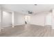 Large living room featuring neutral paint, wood-look tile floors, and a ceiling fan at 32815 N Slate Creek Dr, San Tan Valley, AZ 85143