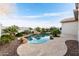 Backyard view of a gorgeous private pool with stone accents and beautiful landscaping at 32815 N Slate Creek Dr, San Tan Valley, AZ 85143