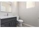 Modern powder room featuring a gray vanity with a marble countertop and a stylish chrome faucet at 32815 N Slate Creek Dr, San Tan Valley, AZ 85143