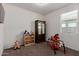 Neutral bedroom with a full-length wardrobe and a large window at 35374 W San Sisto Ave, Maricopa, AZ 85138