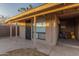 Back porch featuring a doorway with a security door, storage and a concrete floor at 3611 W Hazelwood St, Phoenix, AZ 85019