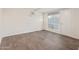 Vacant bedroom featuring hard floors, a window, closet and an AC unit at 3611 W Hazelwood St, Phoenix, AZ 85019