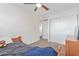 This bedroom features a closet, ceiling fan, carpet, and a bed at 3611 W Hazelwood St, Phoenix, AZ 85019