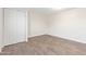 This vacant bedroom features hard floors and a closet at 3611 W Hazelwood St, Phoenix, AZ 85019