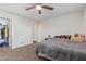 Neutral bedroom with carpet flooring, ceiling fan and closet access at 3611 W Hazelwood St, Phoenix, AZ 85019