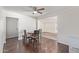 Inviting dining room with space for four, wooden table, and wood look flooring at 3611 W Hazelwood St, Phoenix, AZ 85019