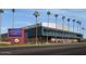 Exterior of Grand Canyon University showcasing the main building with palm trees and landscaping at 3611 W Hazelwood St, Phoenix, AZ 85019