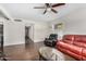 Spacious living room featuring hardwood floors and a ceiling fan at 3611 W Hazelwood St, Phoenix, AZ 85019