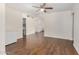 Inviting living room features wood floors, a ceiling fan and neutral walls at 3611 W Hazelwood St, Phoenix, AZ 85019