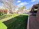 Manicured backyard features synthetic putting green with mature trees at 3912 E Williams Dr, Phoenix, AZ 85050