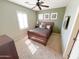 Bedroom featuring a carpet, bed, dresser, ceiling fan, and a bright window at 3912 E Williams Dr, Phoenix, AZ 85050