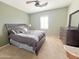 Bedroom with a dark wood bedroom suite, carpet, and plantation shutters at 3912 E Williams Dr, Phoenix, AZ 85050