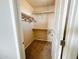 Small walk-in closet featuring carpet and a hanging rod at 3912 E Williams Dr, Phoenix, AZ 85050