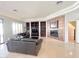 Spacious living room featuring a fireplace, tile flooring and custom built-in shelving at 3912 E Williams Dr, Phoenix, AZ 85050