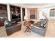 Bright living room with dark wood built-ins, fireplace and tile flooring at 3912 E Williams Dr, Phoenix, AZ 85050