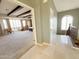 Hallway view into large main bedroom featuring beamed ceilings and shuttered windows at 3912 E Williams Dr, Phoenix, AZ 85050