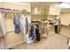 Custom closet with built-in shelving and hanging rods for ample storage at 3912 E Williams Dr, Phoenix, AZ 85050