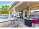 Inviting covered back patio featuring comfortable seating, a table, and a cozy outdoor space for relaxation at 3957 E Adobe St, Mesa, AZ 85205