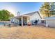 Wide backyard featuring a large covered patio, a built-in pool, and a play area for Gathering fun at 3957 E Adobe St, Mesa, AZ 85205