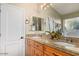 Bathroom with dual sinks, granite countertop, and a mirror at 3957 E Adobe St, Mesa, AZ 85205