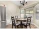 Cozy dining area with a table for four, complemented by abundant natural light at 3957 E Adobe St, Mesa, AZ 85205