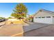 Well-maintained home with a spacious driveway and an attached two-car garage at 3957 E Adobe St, Mesa, AZ 85205