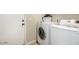 Functional laundry room with a white washer and dryer set, complemented by neutral wall colors and practical design at 3957 E Adobe St, Mesa, AZ 85205