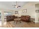 Comfortable living room with hardwood floors and a ceiling fan at 3957 E Adobe St, Mesa, AZ 85205