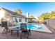 Sparkling pool surrounded by a patio, inviting chairs, and a cozy setting for outdoor enjoyment at 3957 E Adobe St, Mesa, AZ 85205