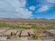 An aerial view of a single-Gathering home with desert landscaping, tile roof, and golf course view at 40607 N Candlewyck Ln, Phoenix, AZ 85086