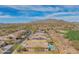 An aerial view of a house with mountain views, and golf course, highlighting the pool area at 40607 N Candlewyck Ln, Phoenix, AZ 85086