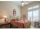 Bright bedroom with natural light features high ceiling and a classic brass bed frame at 40607 N Candlewyck Ln, Phoenix, AZ 85086